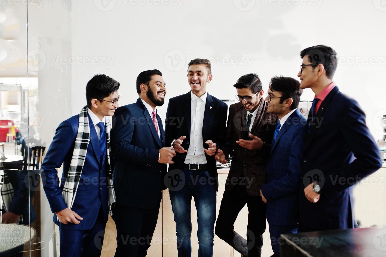 Group of six indian business man in suits standing on cafe and disscuss something. photo