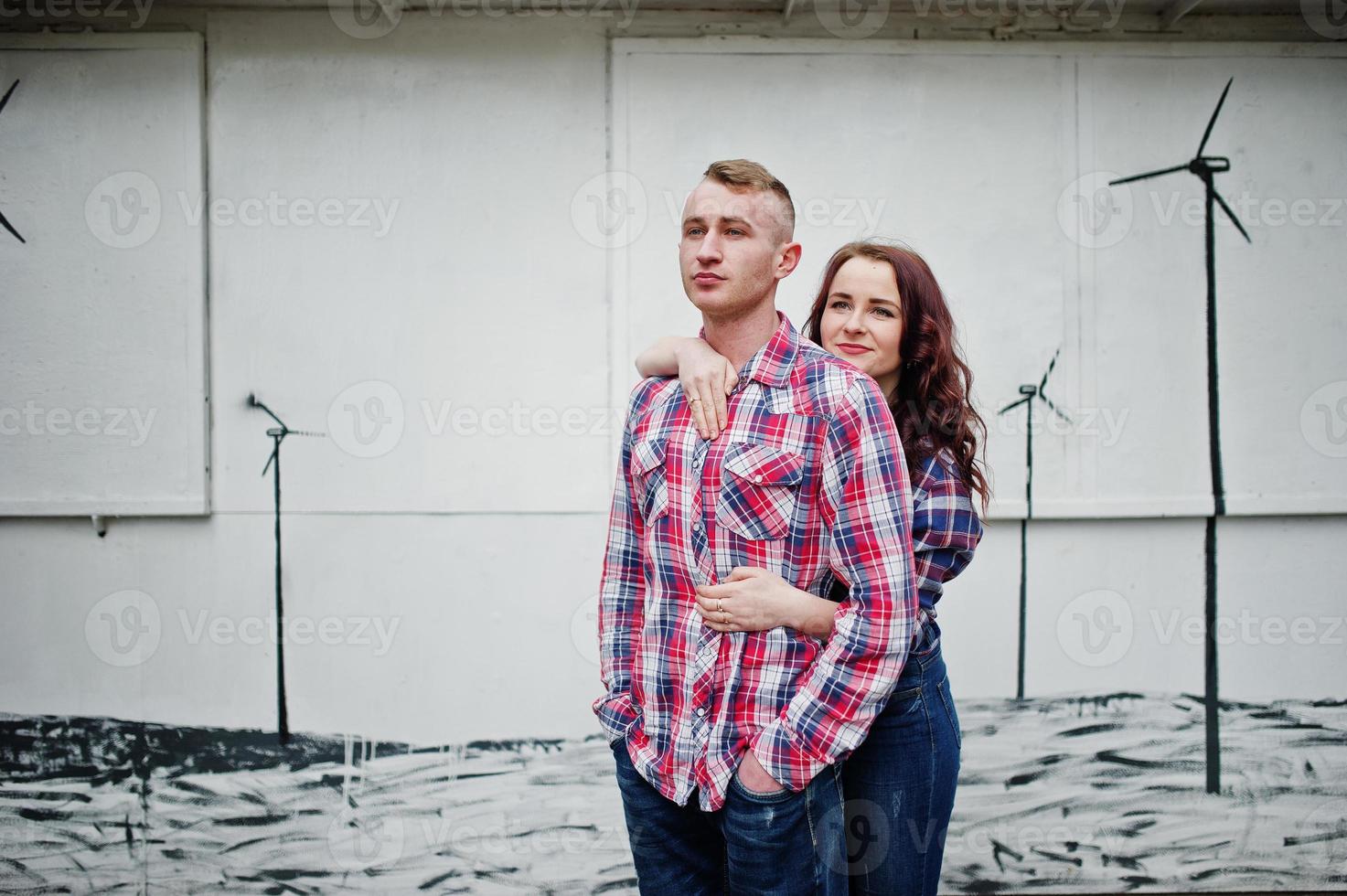 Stylish couple wear on checkered shirt in love together. photo