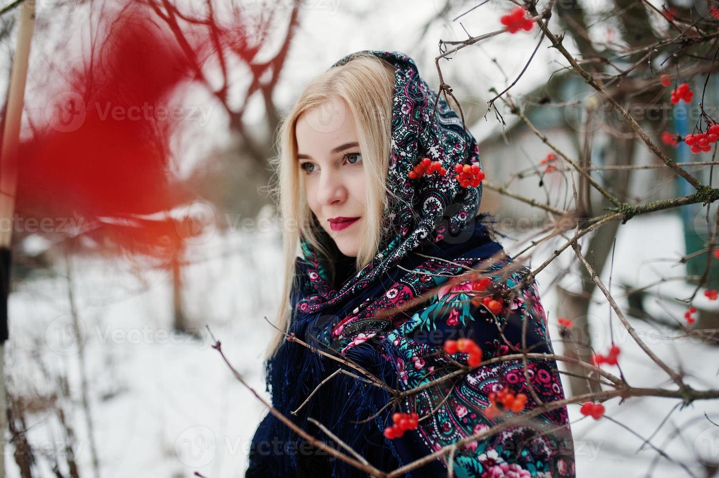 Blonde girl with hand embroidered scarf posed at winter day. Women's handkerchief. photo