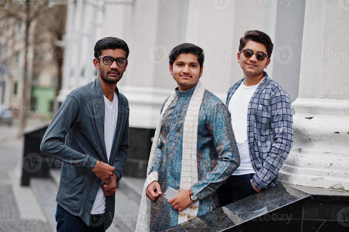Group of three south asian indian mans in traditional and casual wear. photo