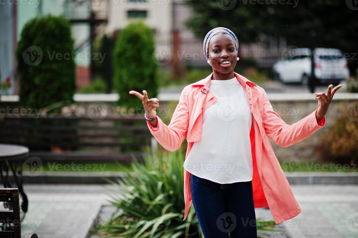 Young modern fashionable, attractive, tall and slim african muslim woman in hijab or turban head scarf posed. photo