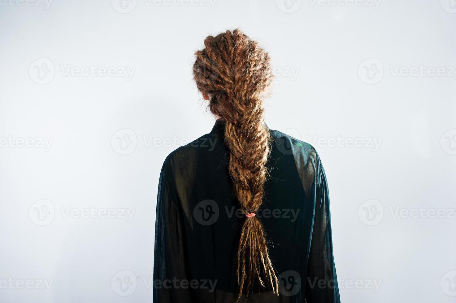 Studio shoot of back girl with dreads on white background. photo