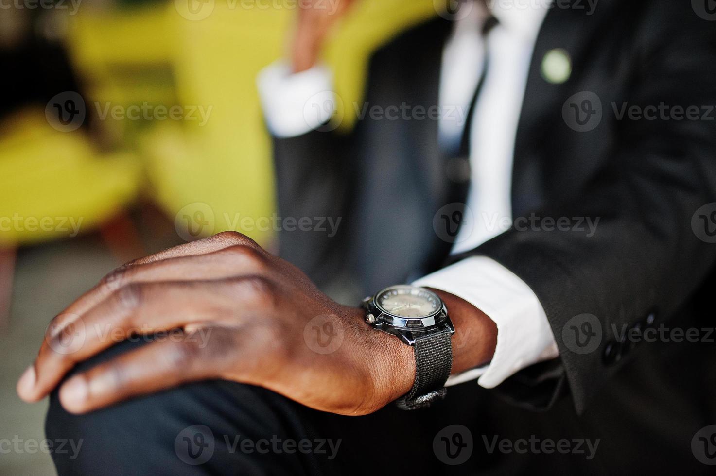 Close up hand of african american business man with watches. photo
