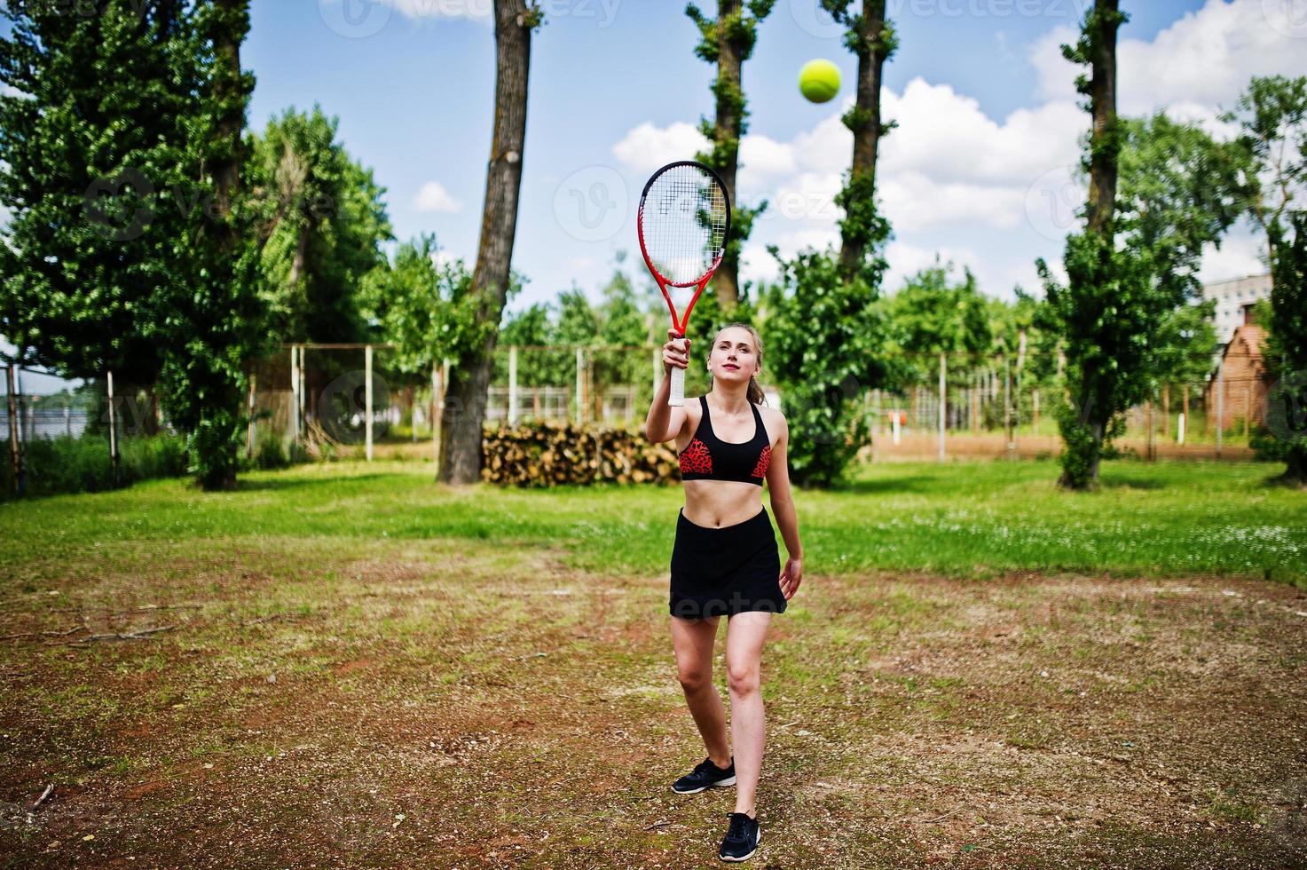 Beautiful sport woman tennis player with racket in sportswear costume. photo