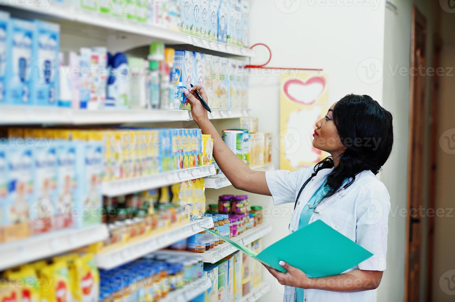 African american pharmacist working in drugstore at hospital pharmacy. African healthcare. photo