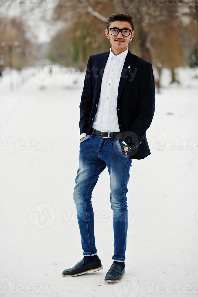 Stylish indian student man in suit and glasses posed at winter day outdoor. photo