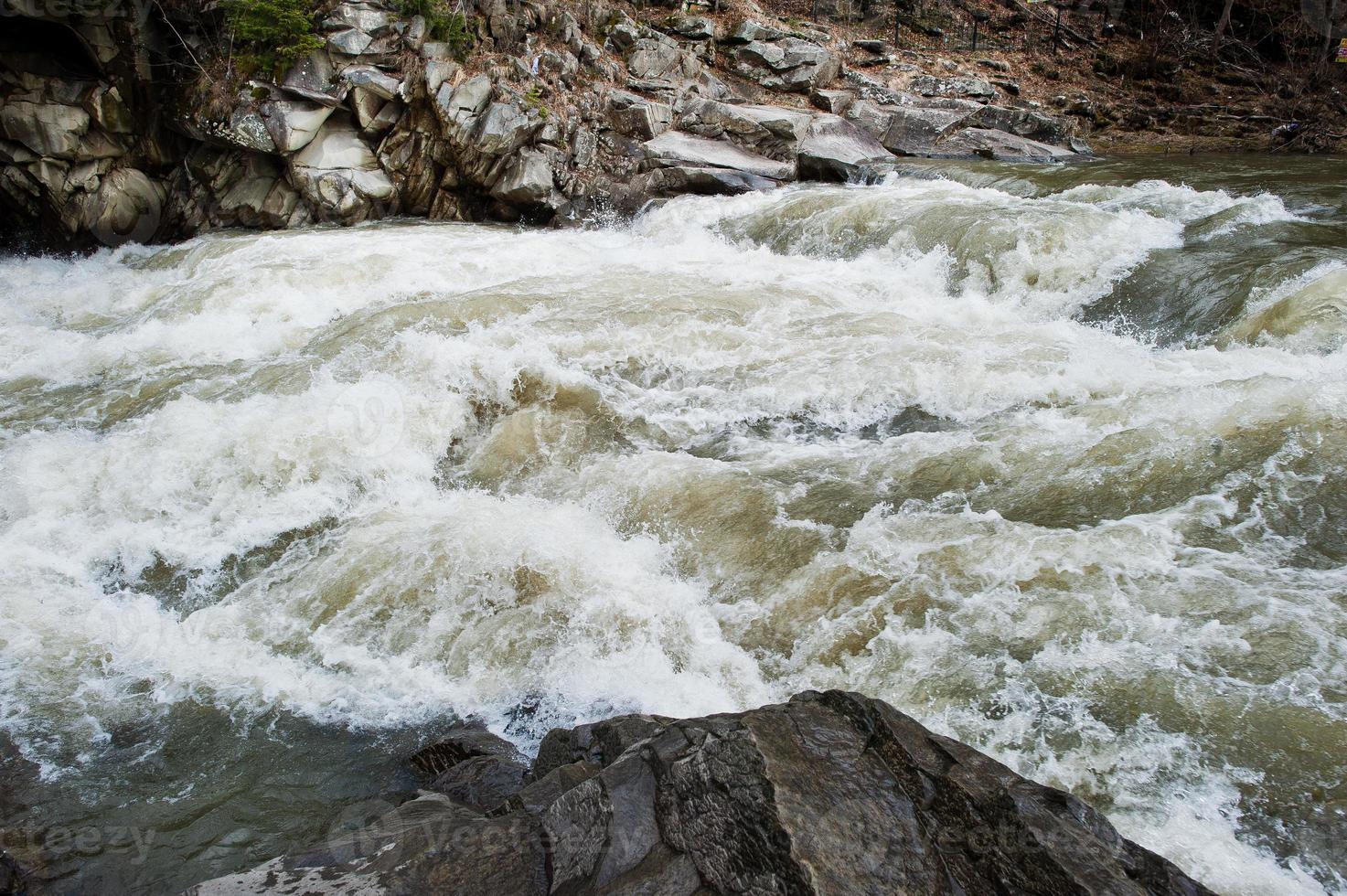 Incredible and stormy Prut river at Carpathian mountains, Jaremcze resort, Ukraine, Europe. photo