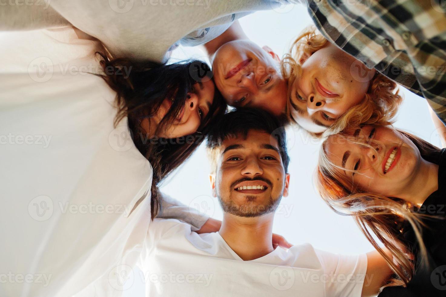 Young multi ethnic group of people in open air cinema. photo