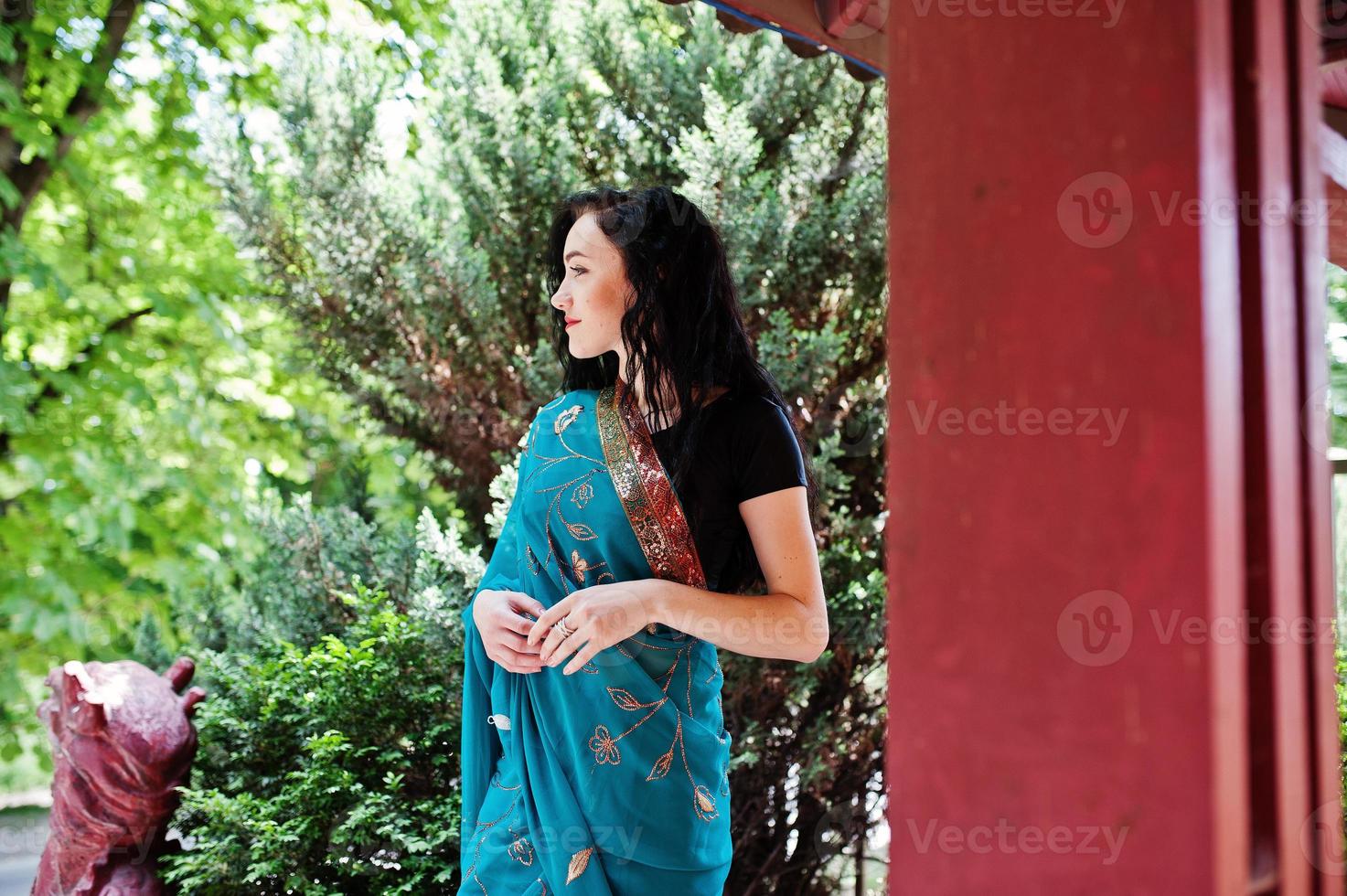 Portrait of beautiful indian brumette girl or hindu woman model against japanese traditional house. photo