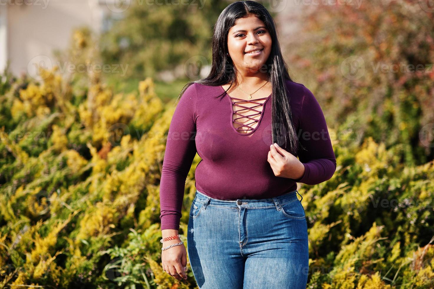 Pretty latino xxl model girl from Ecuador wear on violet blouse posed at street. photo