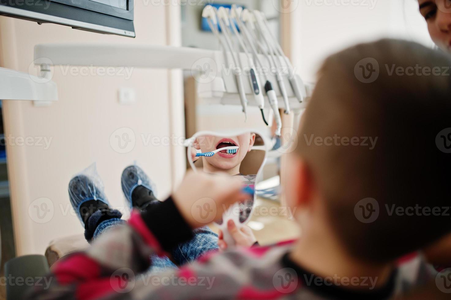 Little boy at dentist chair. Children dental. photo