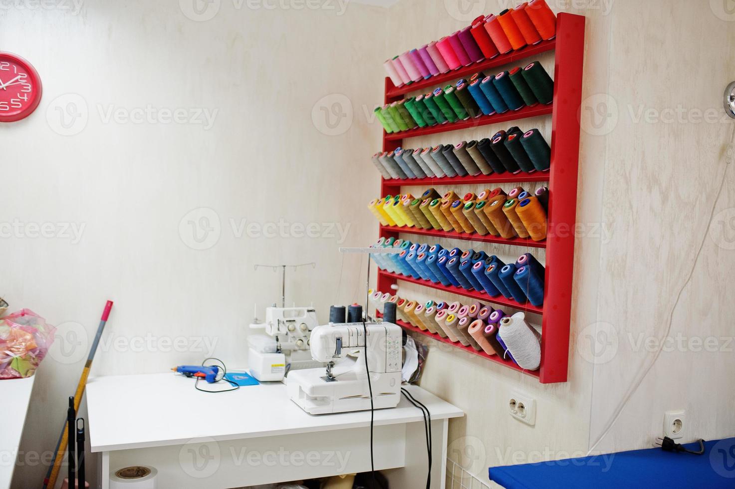 Workplace of seamstress office with sewing machine on table. photo