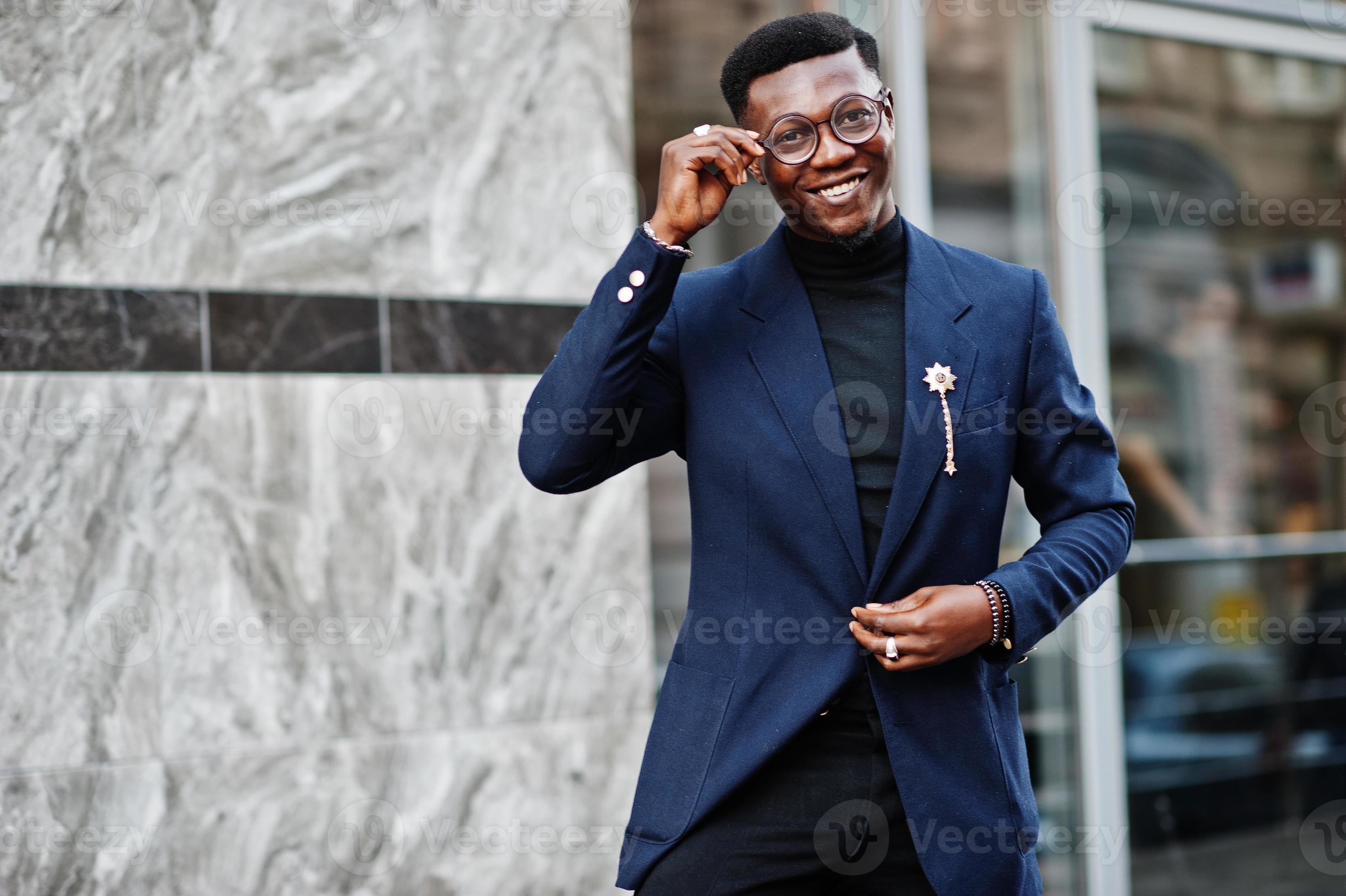 Amazingly looking african american man wear at blue blazer with brooch ...