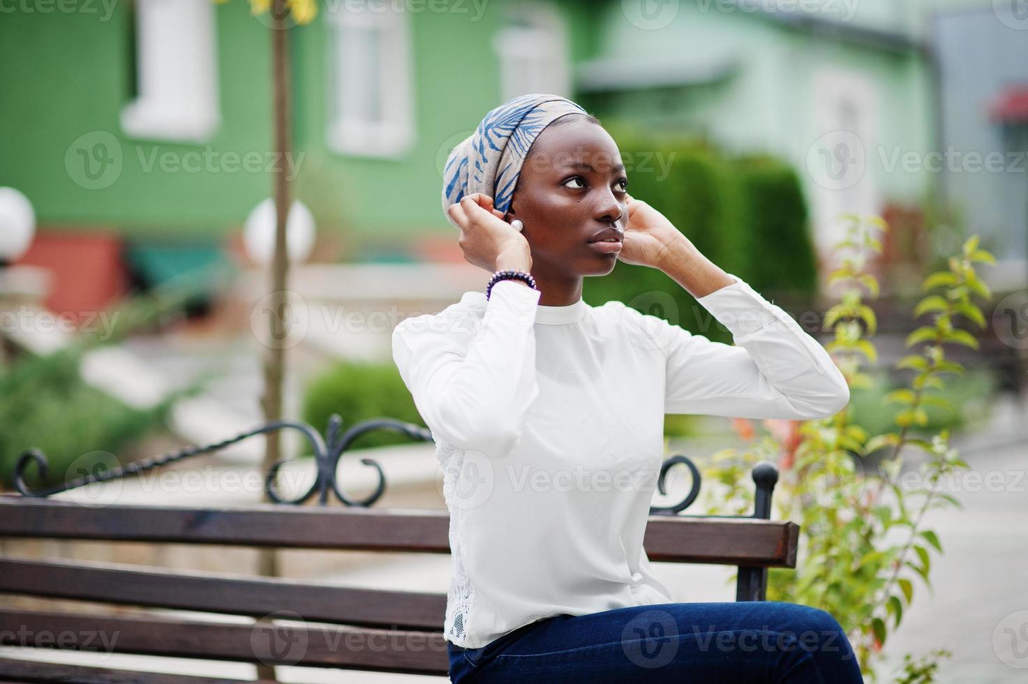 Young modern fashionable, attractive, tall and slim african muslim woman in hijab or turban head scarf posed. photo