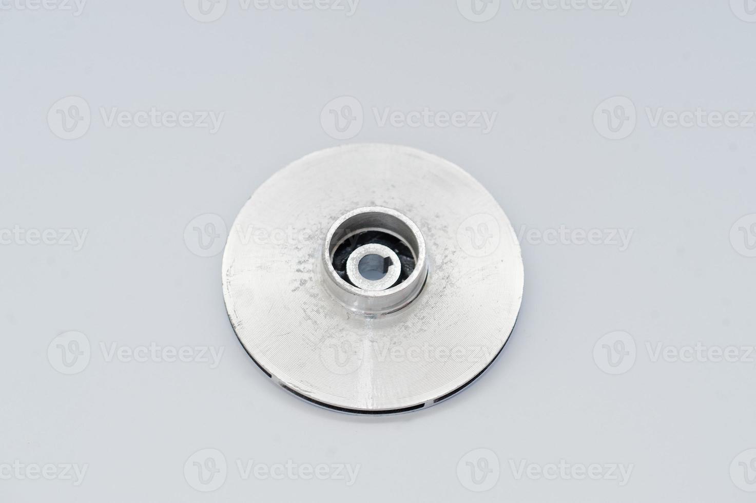 Spare part round disc for water pump isolated on white. photo
