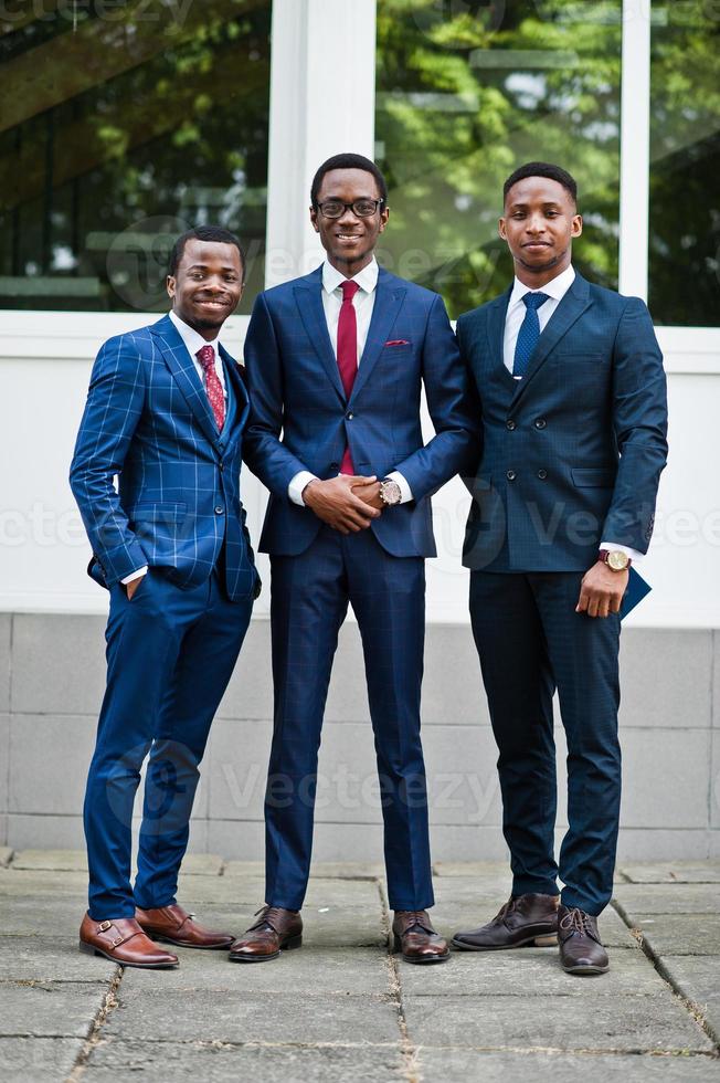 Three african american happy successful mans at suit. photo