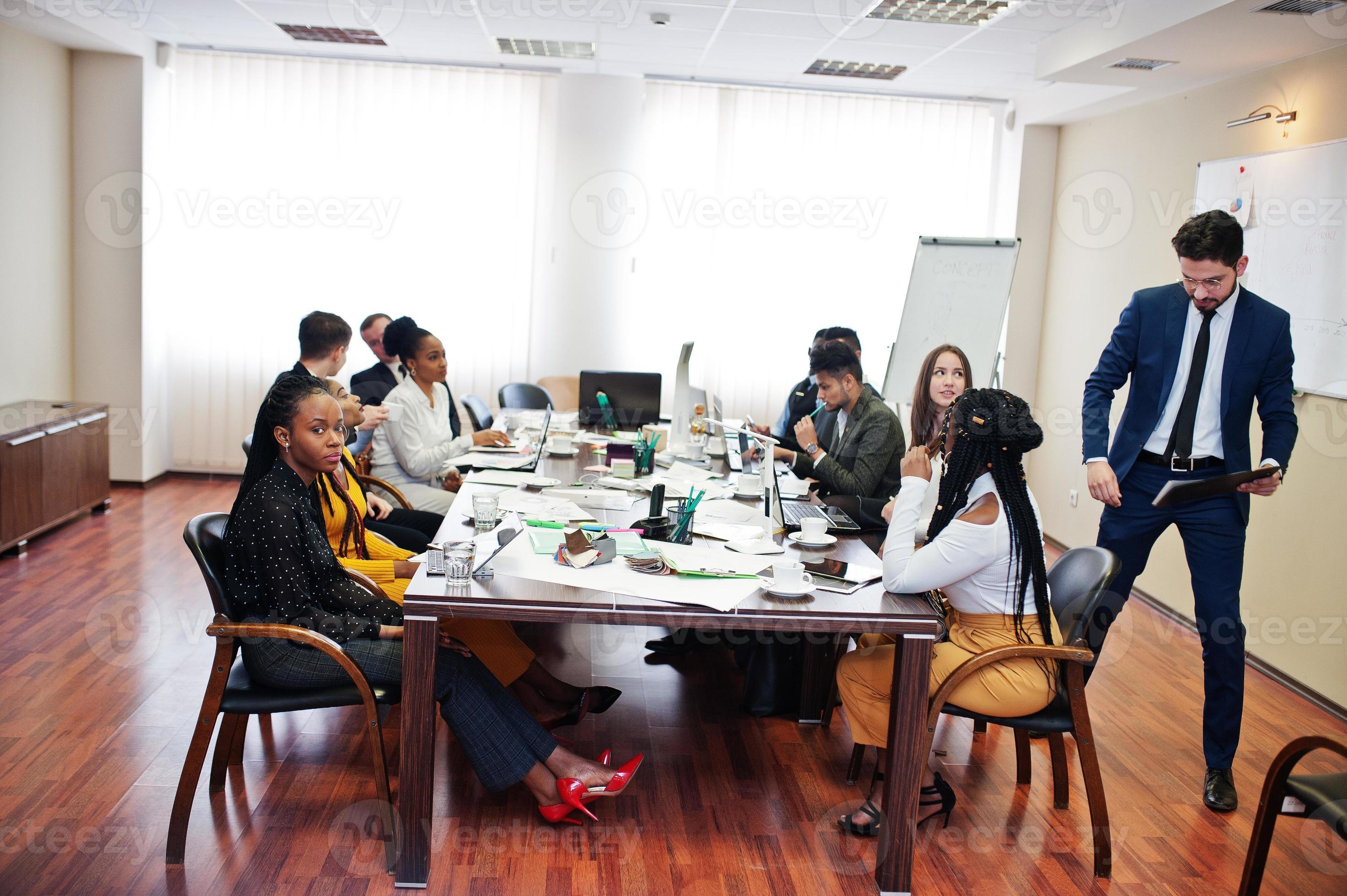 Diverse business people on a meeting at round table. 10499062 Stock Photo at Vecteezy