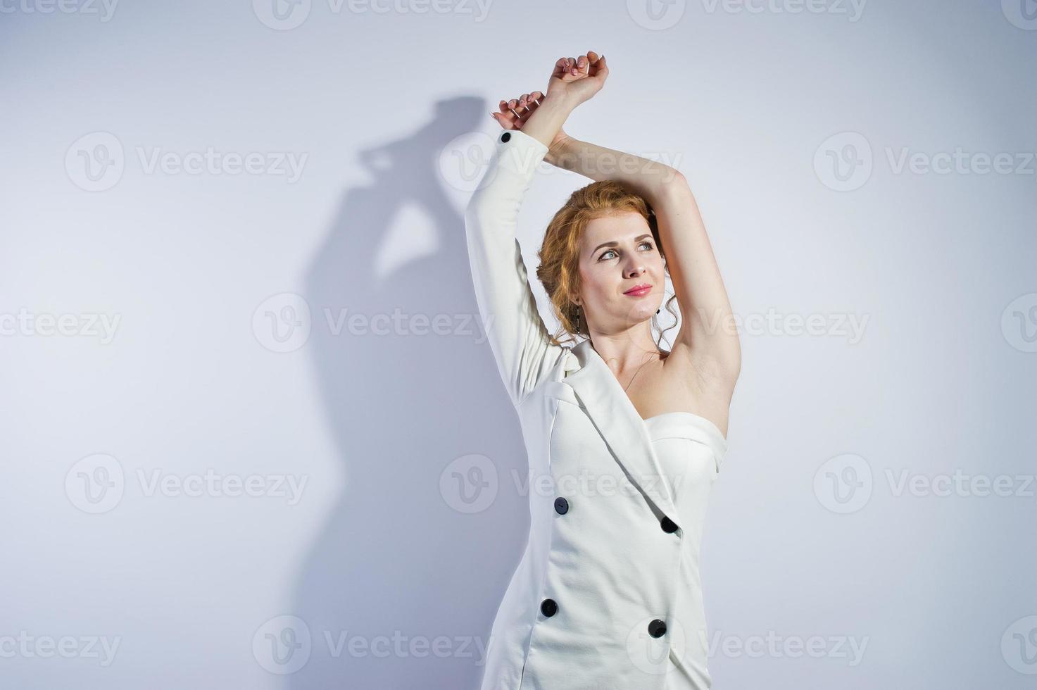 Curly hair girl isolated on white studio background. photo