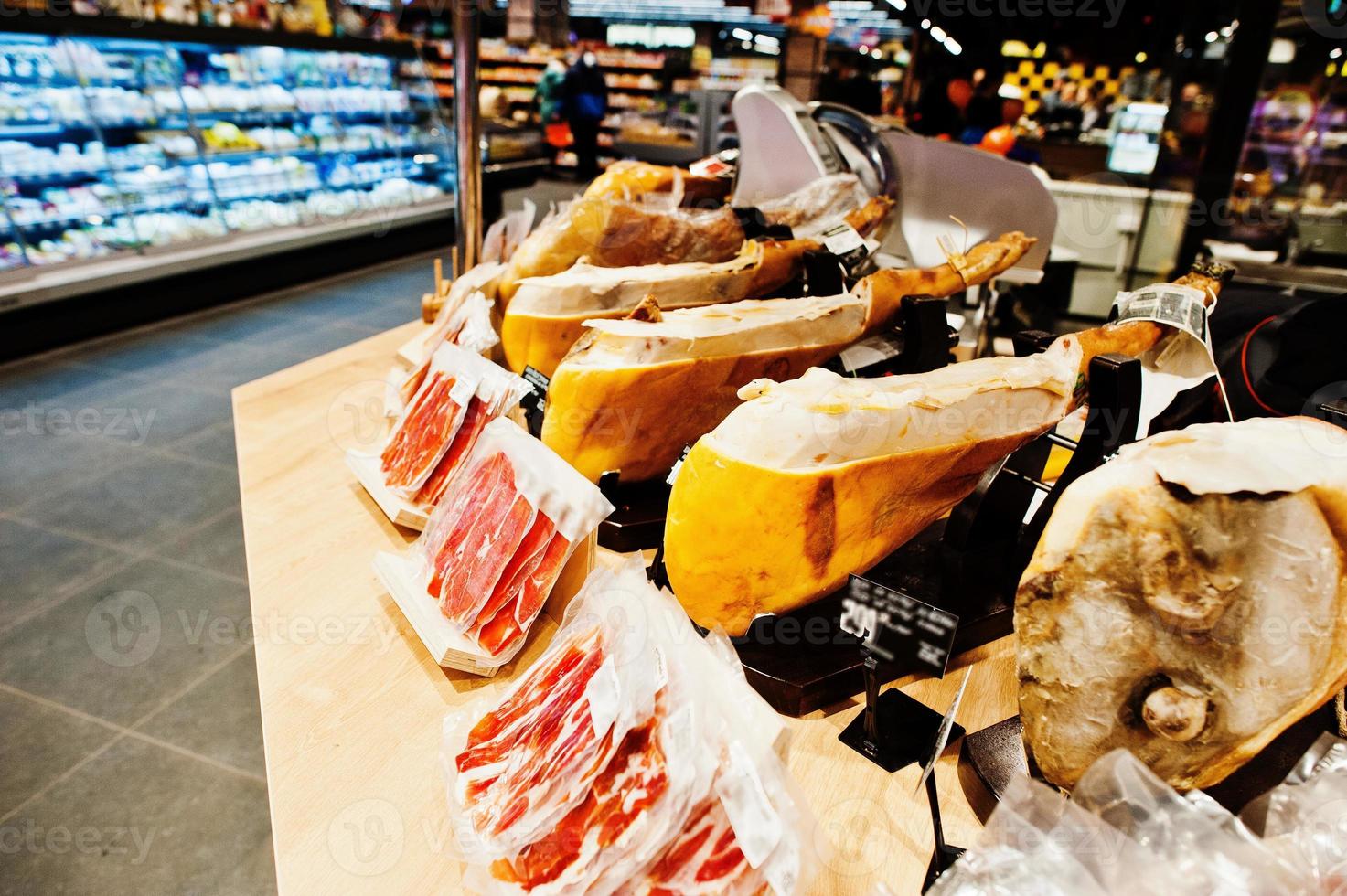 Traditional spanish jamon ham for sale at supermarket. photo