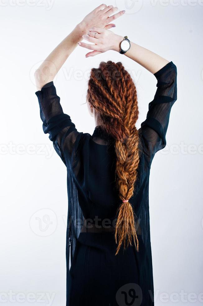 Studio shoot of back girl with dreads on white background. photo