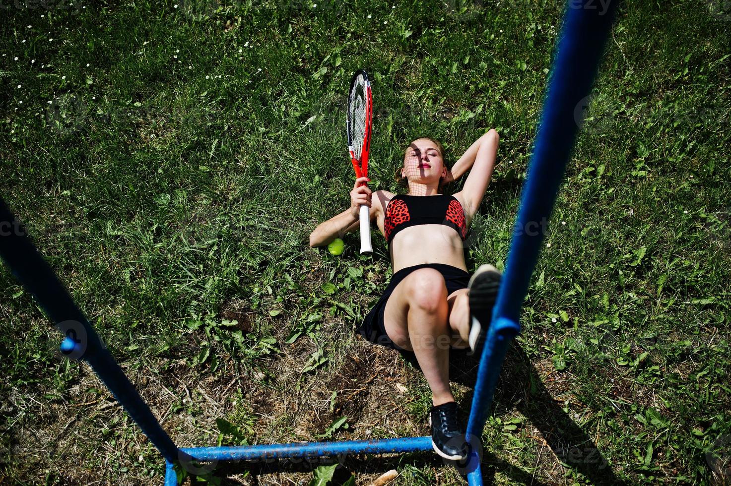 Beautiful sport woman tennis player with racket in sportswear costume. photo
