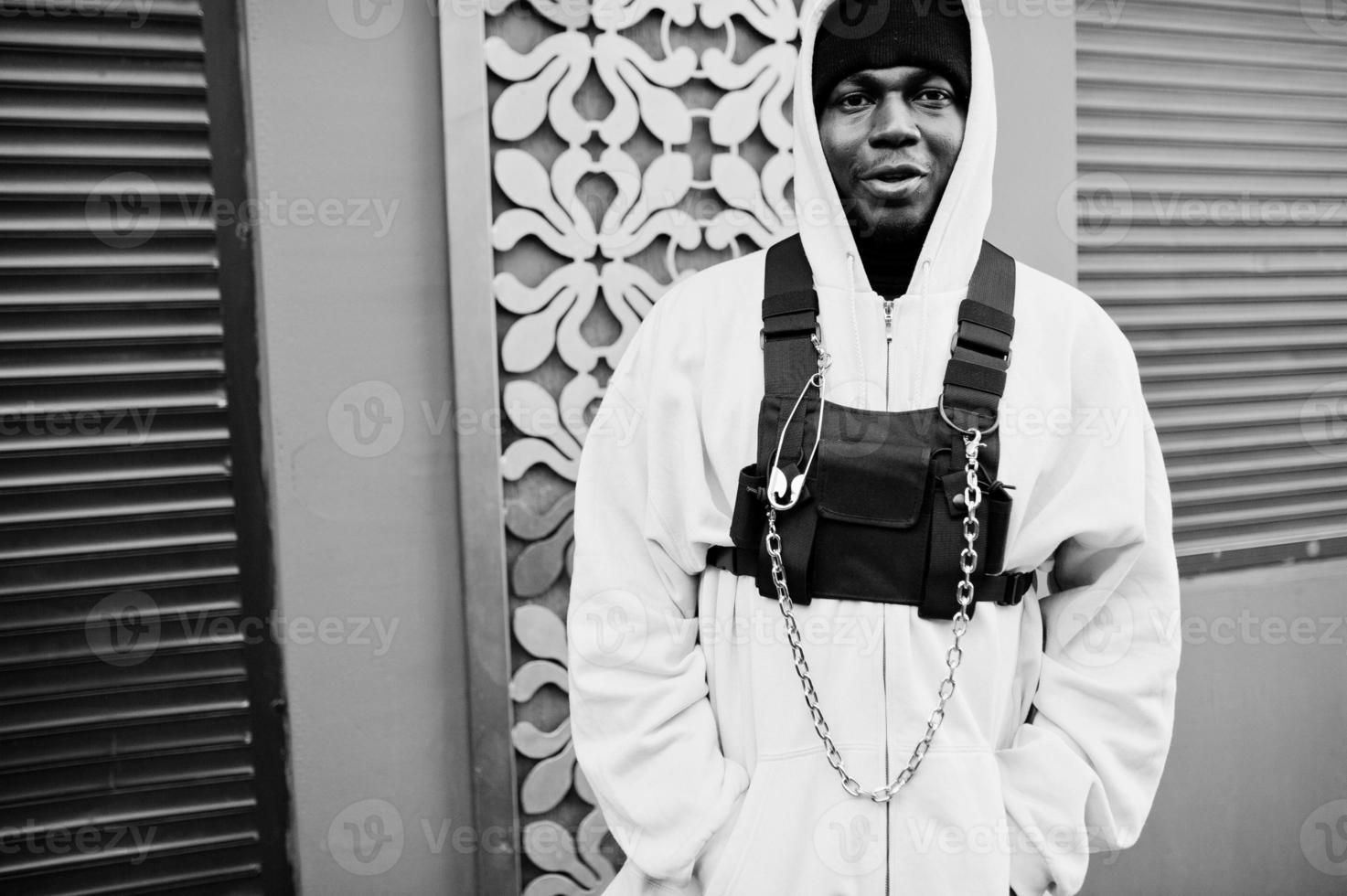 Stylish urban style african american man in pink hoodie posed. Afro rapper guy. photo