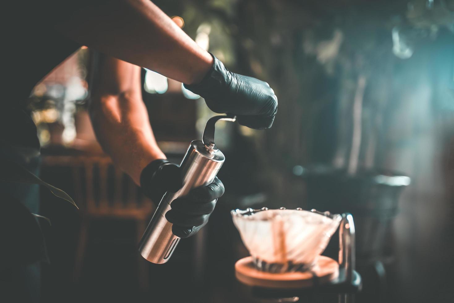 Vietnamese filtered or poured Vietnamese coffee dripping beer is a method that involves pouring water over the ground roasted coffee beans contained in a filter coffee shop in Asia. photo