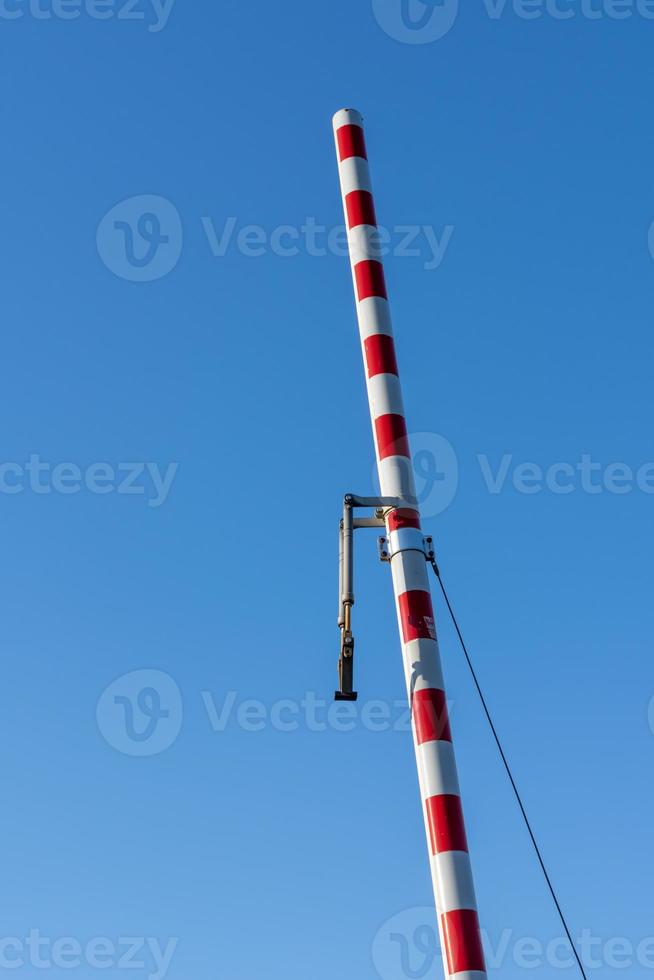 a railway barrier with a view from below photo