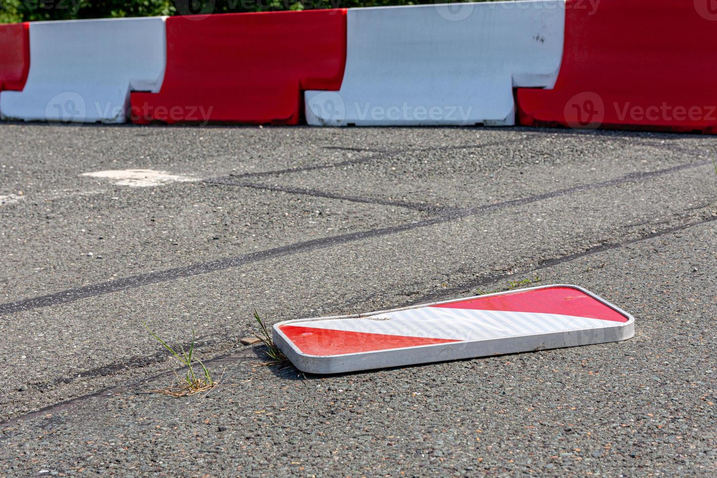 Damaged bent reflector or chevron from a car photo