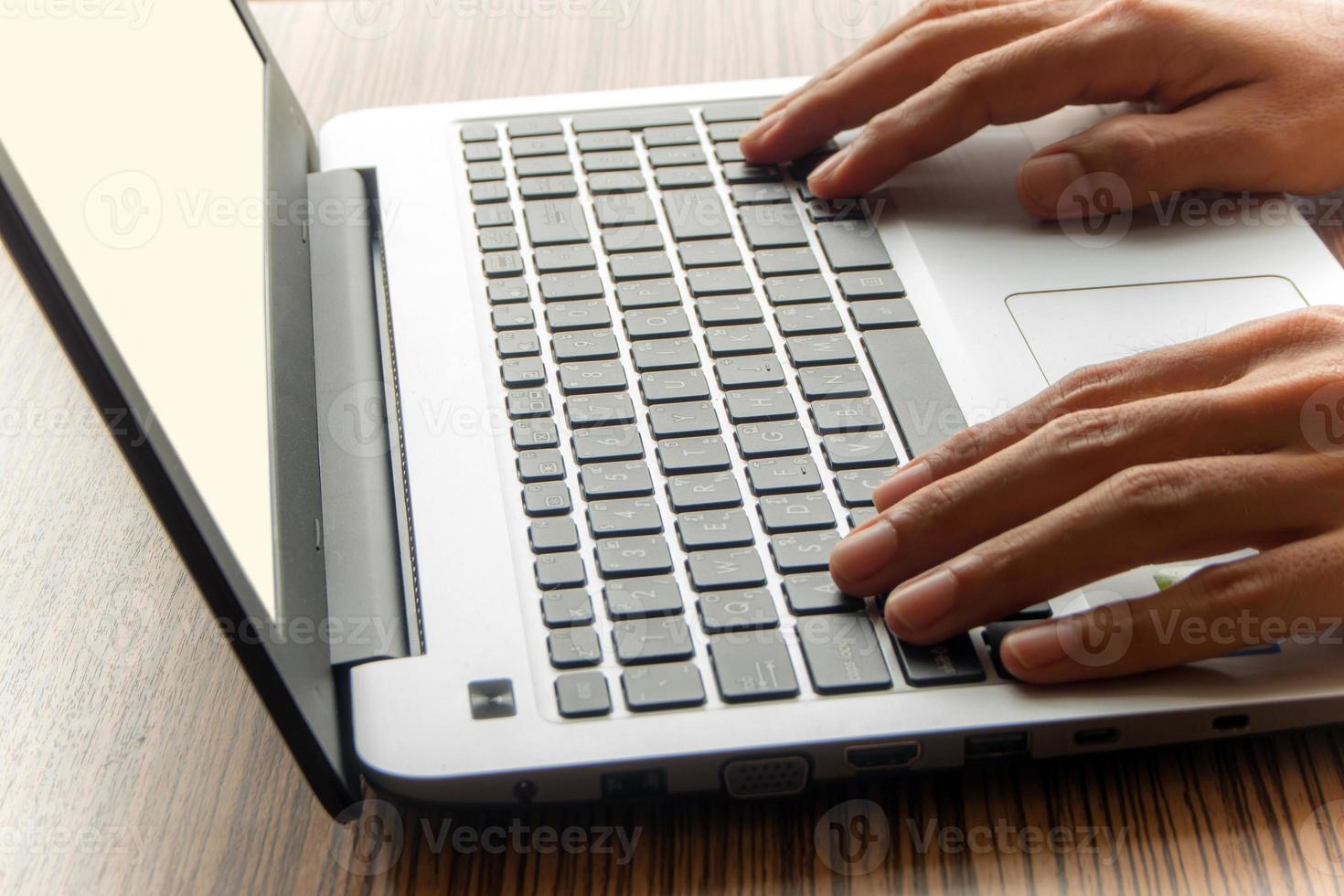 A man working with laptop photo