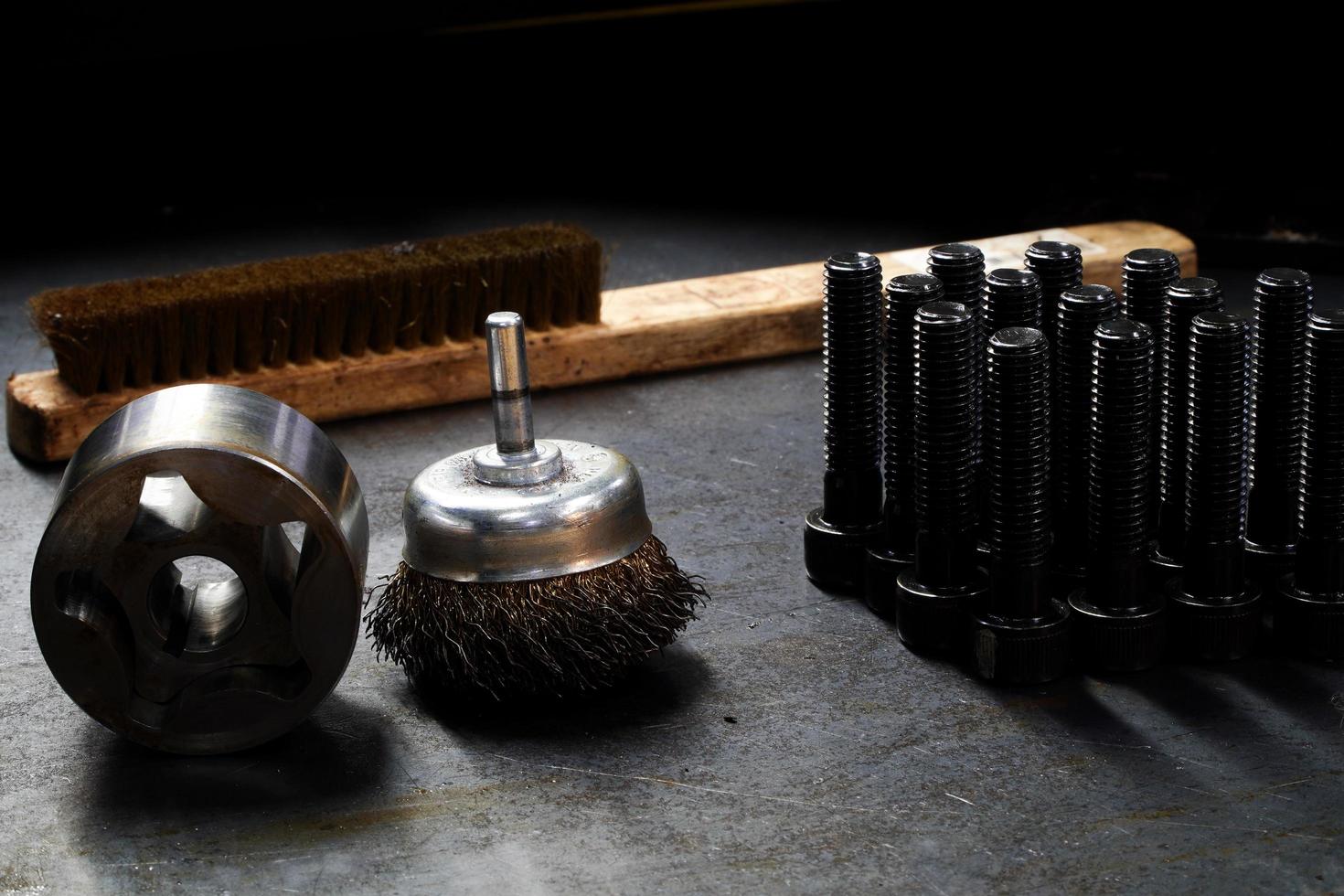 brass brush-wire brush against the workpiece and Hexagonal Socket Head Bolt,industrial concept photo