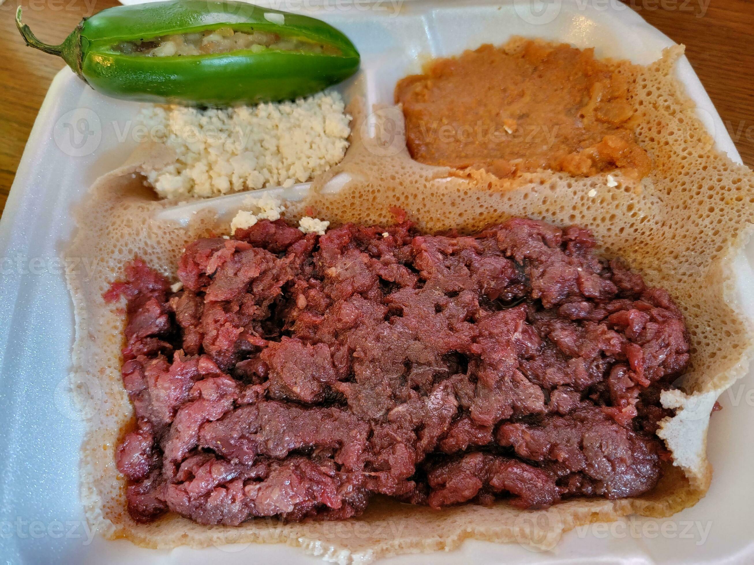 Ethiopian food kitfo raw beef and injera bread 10508867 Stock Photo at