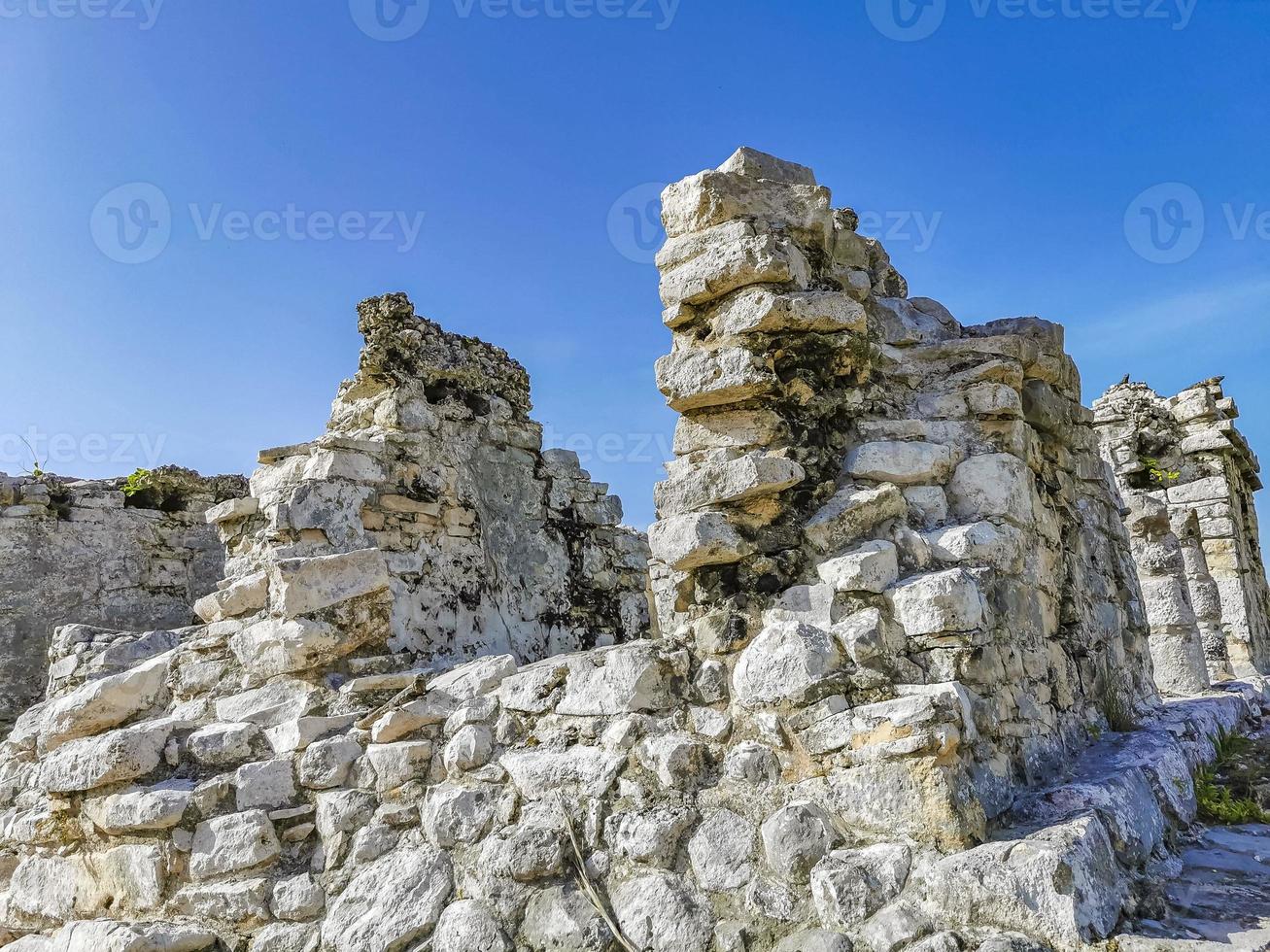 Ancient Tulum ruins Mayan site temple pyramids artifacts seascape Mexico. photo