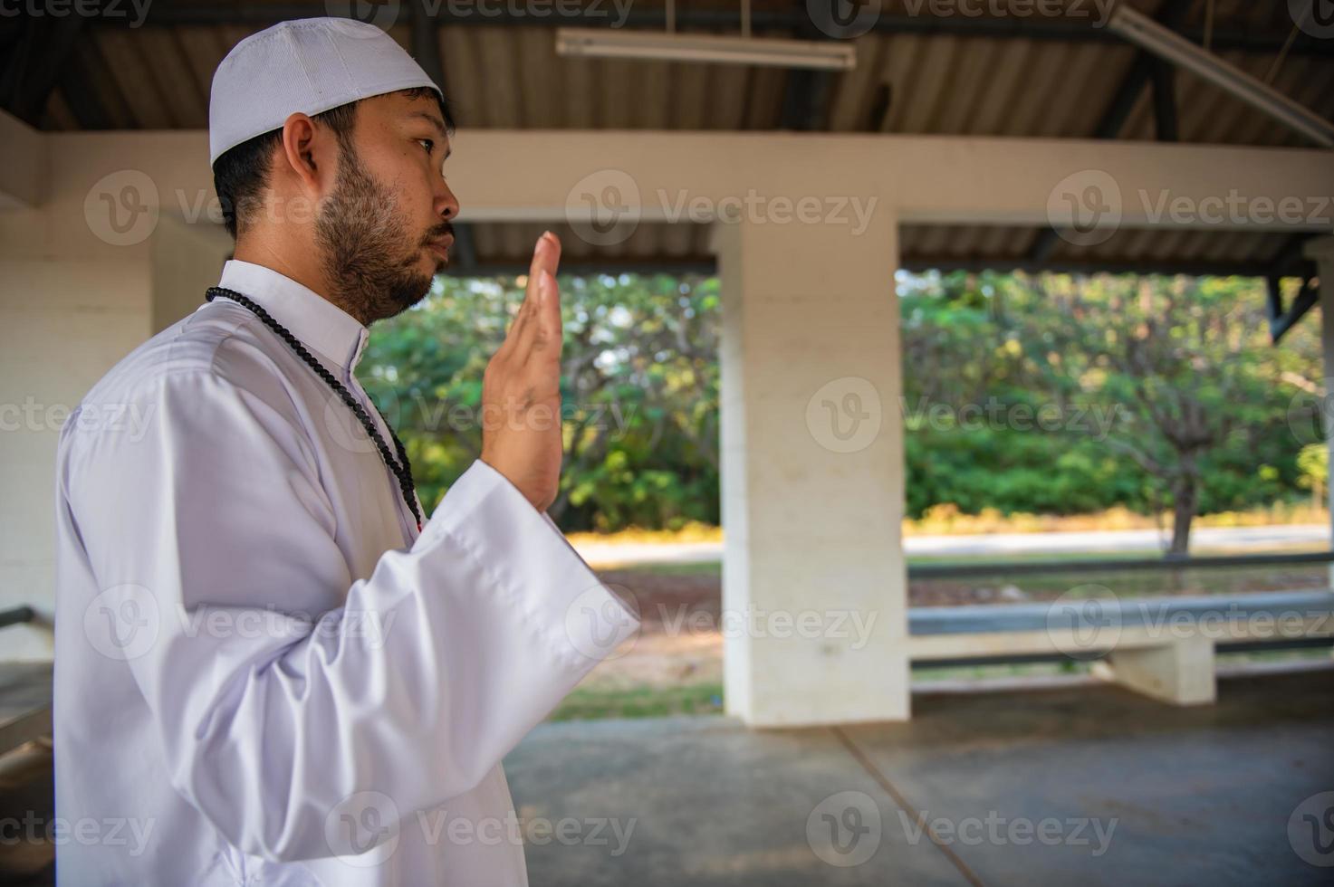 Asian islam man prayer,Young Muslim praying,Ramadan festival concept photo