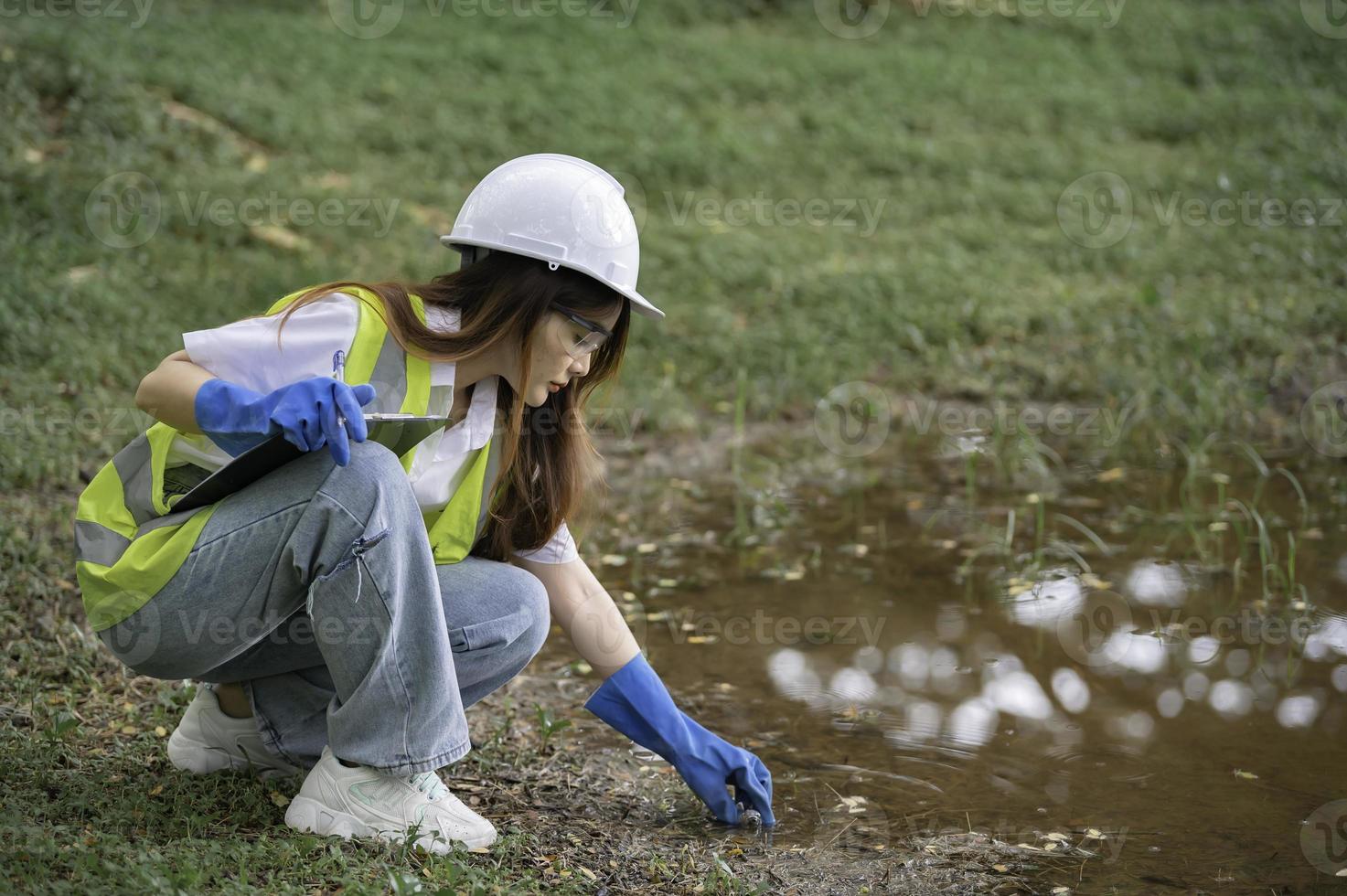 Environmental engineers inspect water quality,Bring water to the lab for testing,Check the mineral content in water and soil,Check for contaminants in water sources. photo