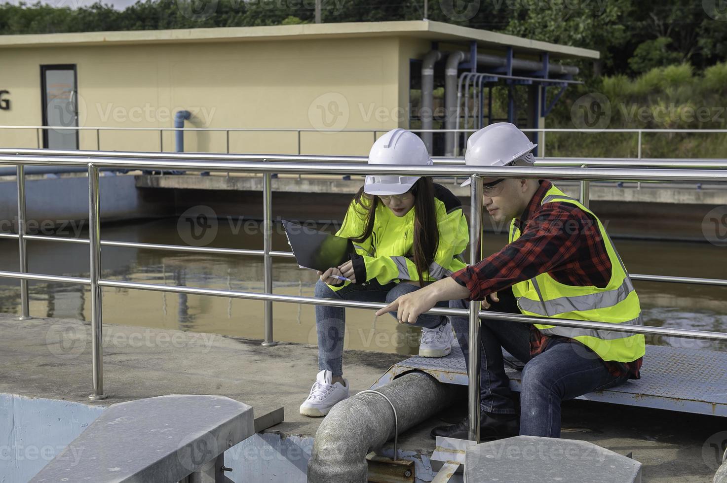 Environmental engineers work at wastewater treatment plants,Water