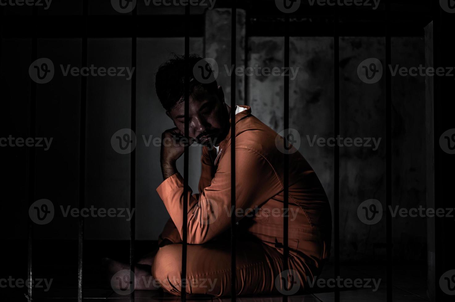Asian man desperate at the iron prison,prisoner concept,thailand people,Hope to be free,Serious prisoners imprisoned in the prison photo