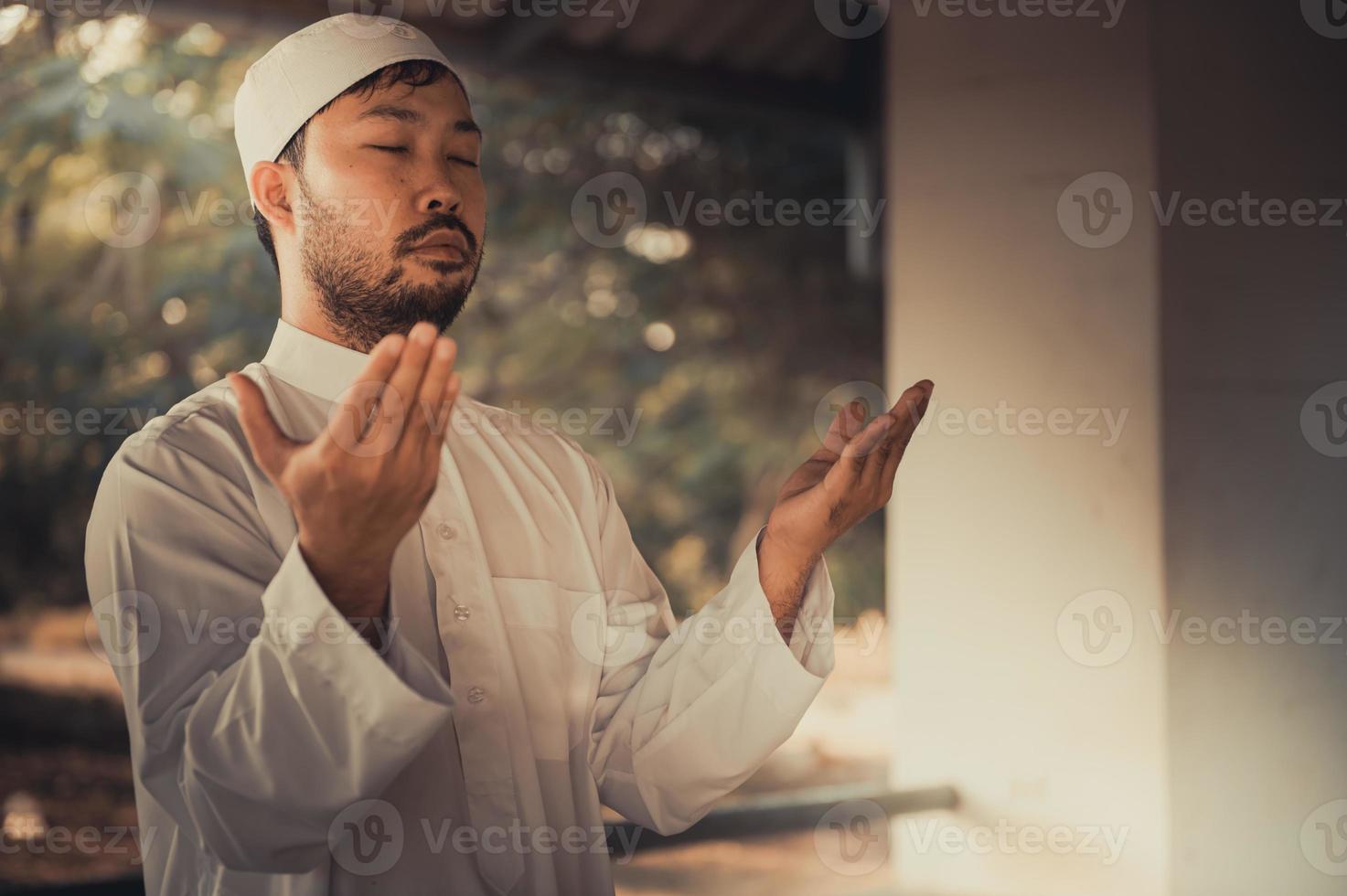 Asian islam man prayer,Young Muslim praying,Ramadan festival concept photo