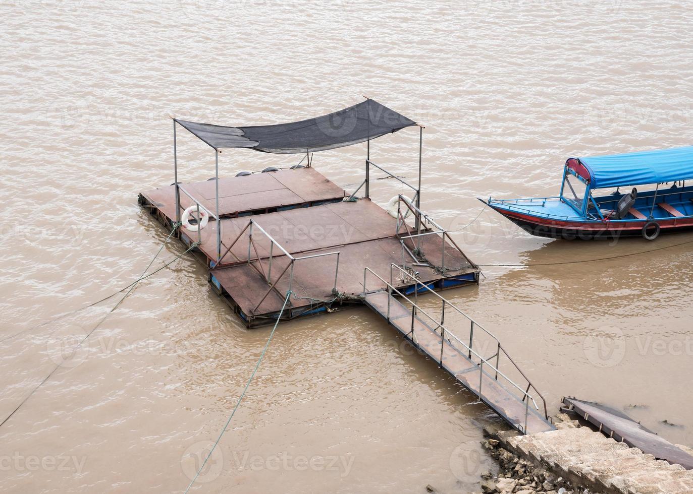 Old local pontoon with the long tail boat. photo