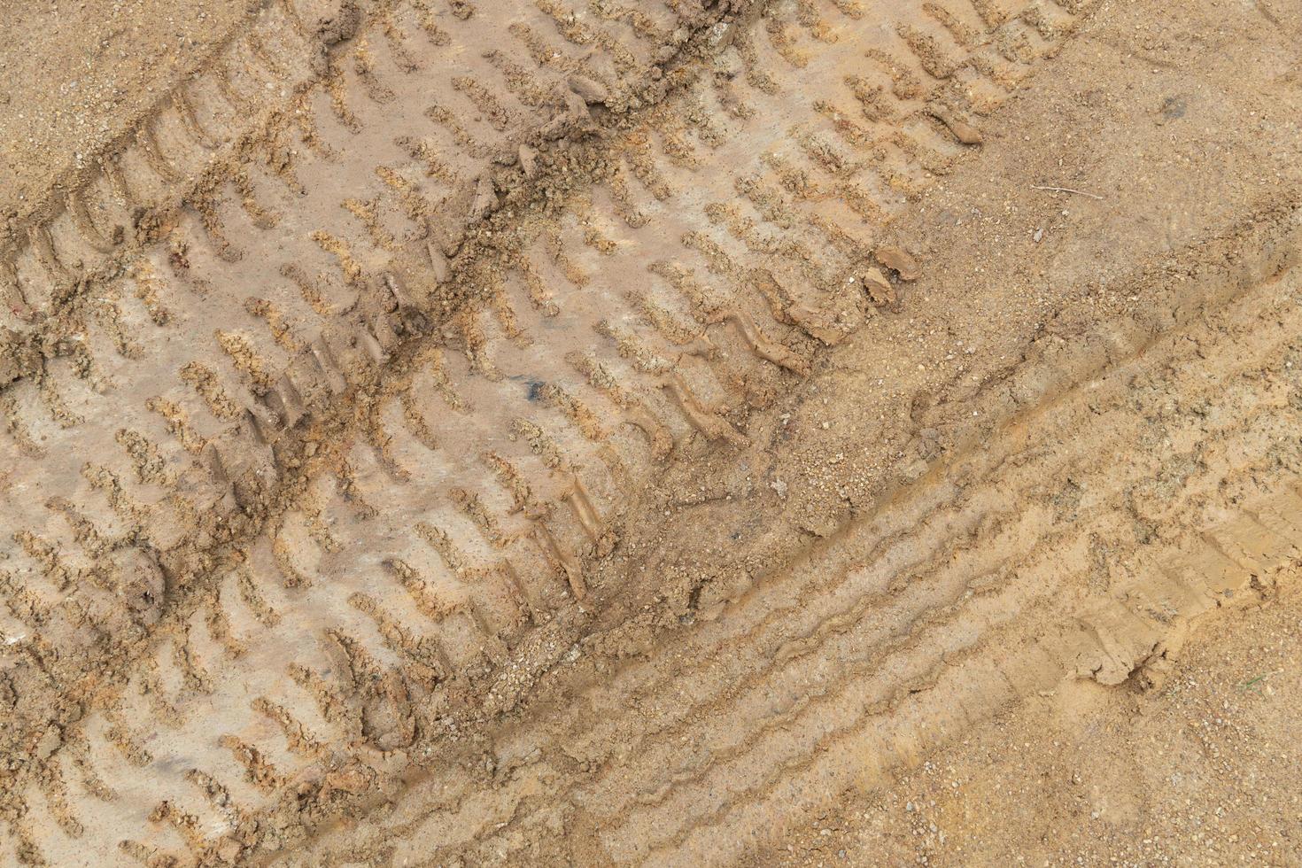 Above view of liquid mud off road and there are marks of tires. photo