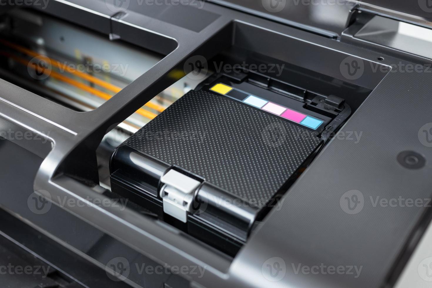 Close up of a multicolor ink cartridges container of a printer photo