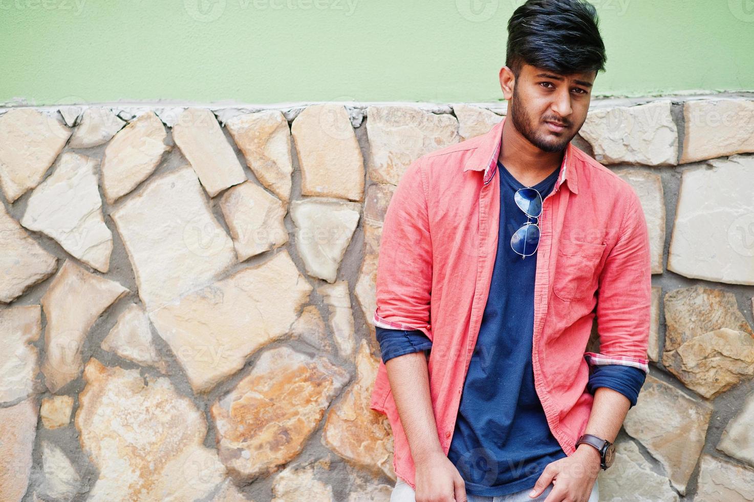 Portrait of young stylish indian man model pose in street. photo