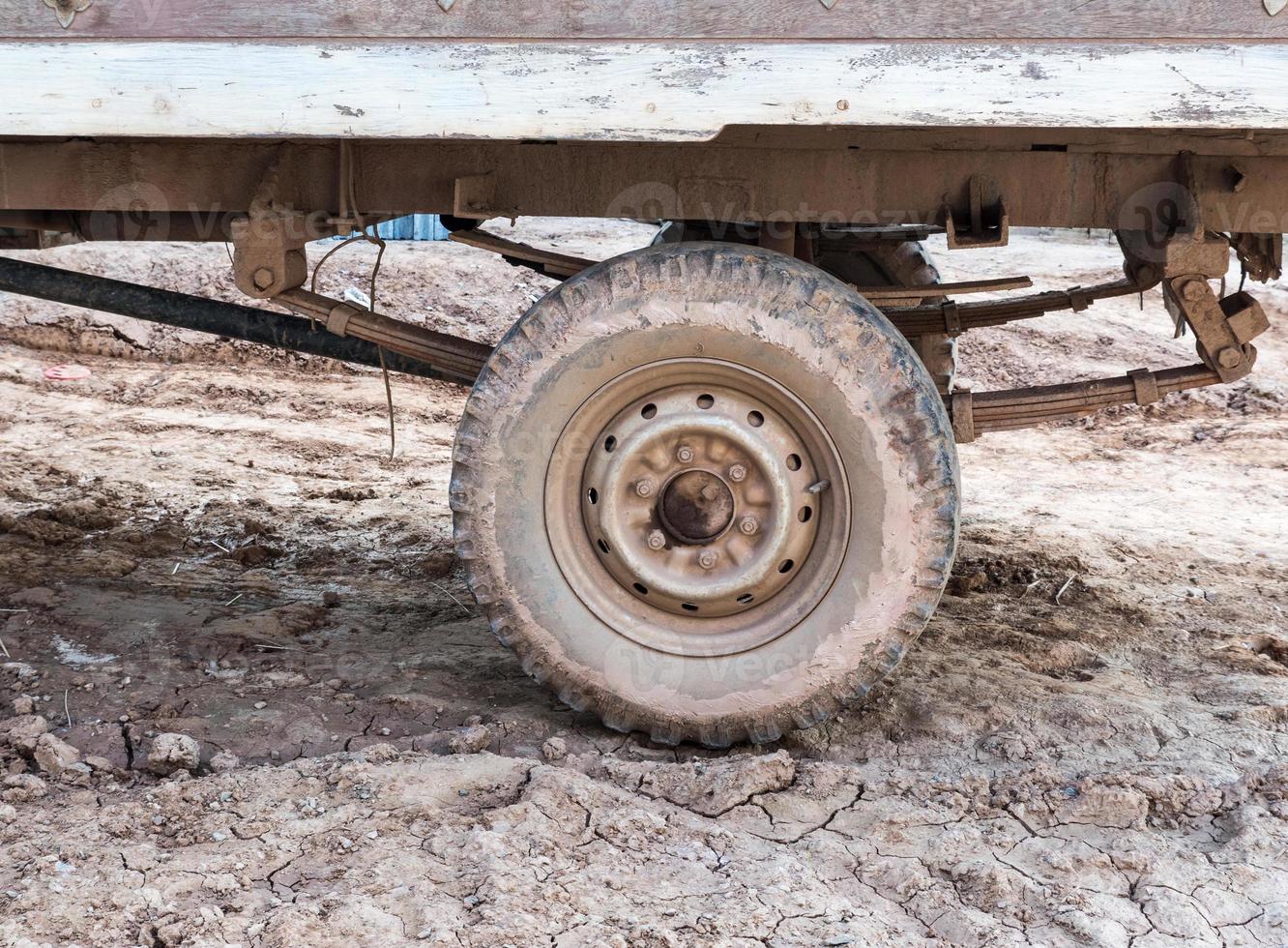 Dirty wheel of the local small truck. photo