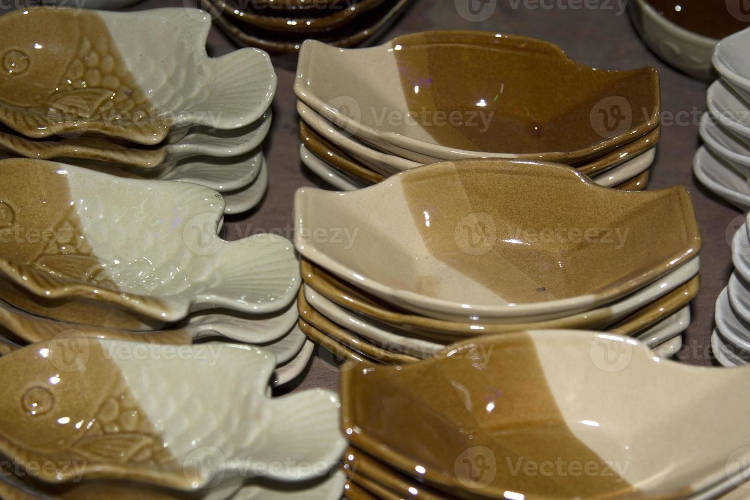 Pottery and ceramics that are modernly designed, such as dishes, mugs, small pots and many shapes, spheres, squares, as food containers. Coffee and others are sold at various shops and festivals photo