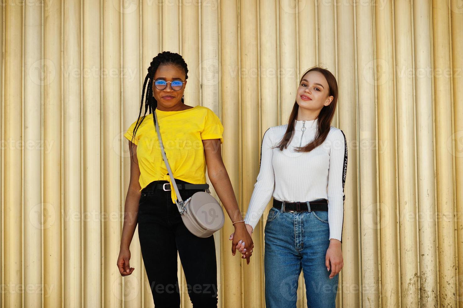 White caucasian girl and black African American together. World unity, racial love, understanding in tolerance and races diversity cooperation. photo