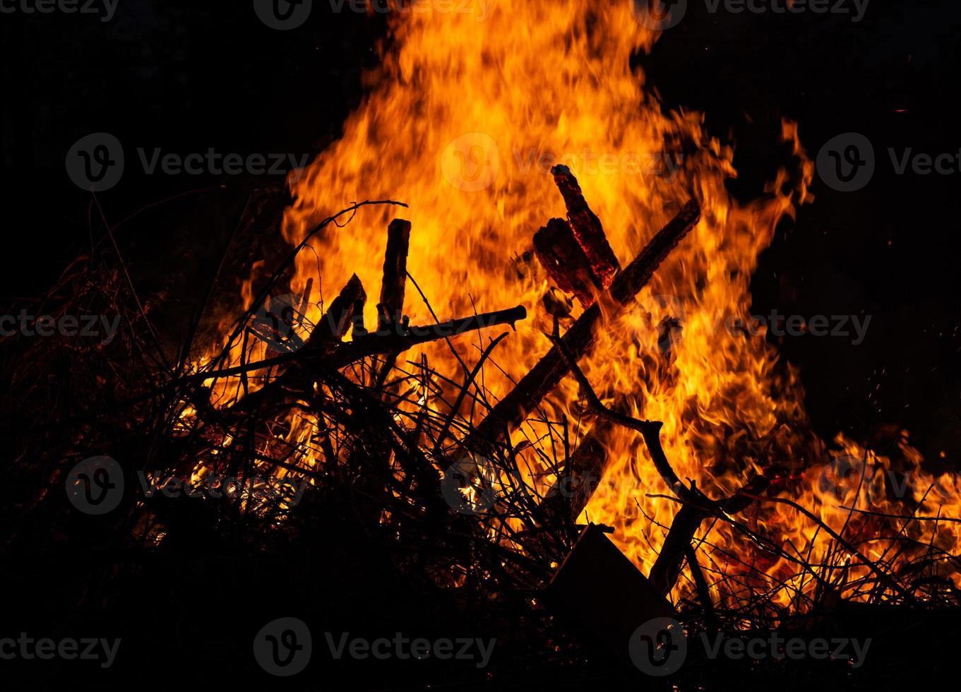 a burning pile of wood photo