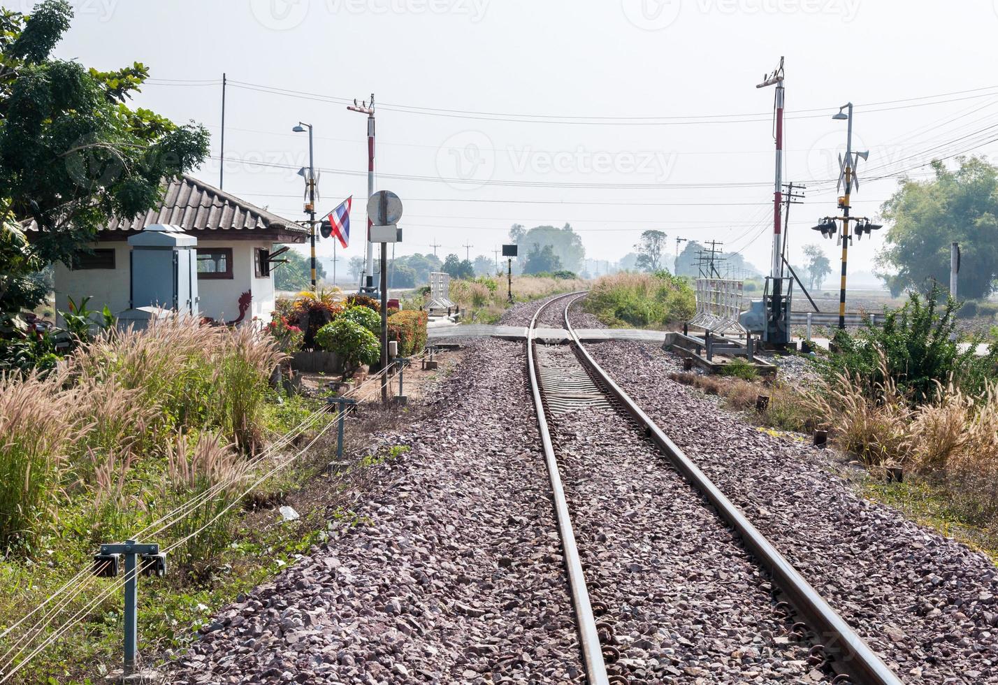 Railway intersection with the automatic barrier. photo