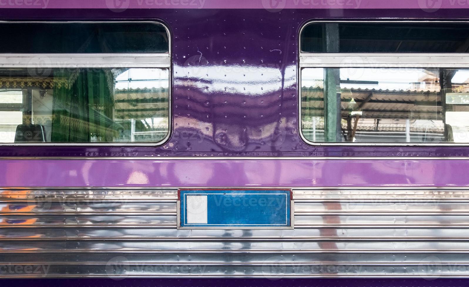 Side view of the stainless passenger car. photo