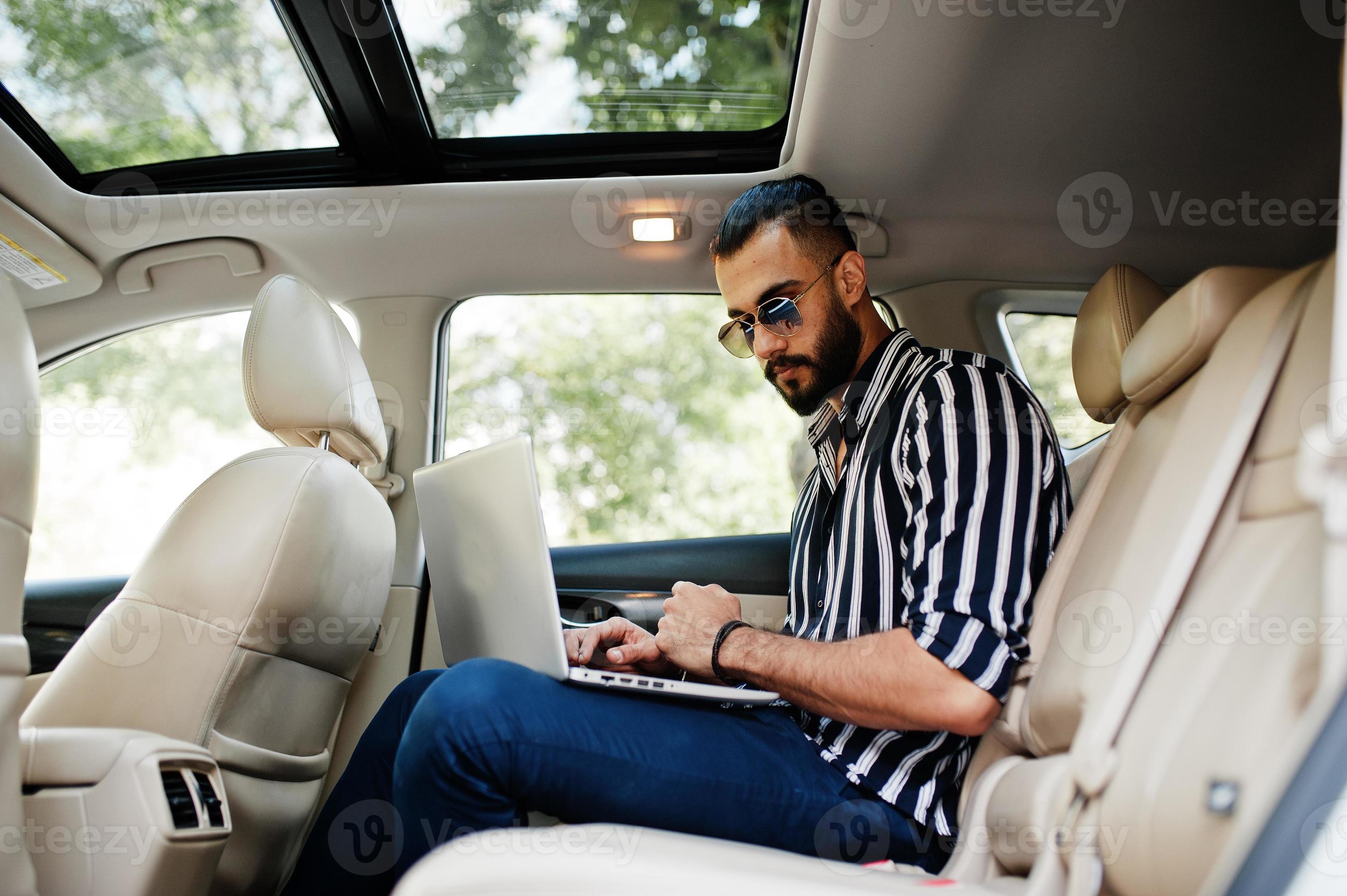 Casual Young Indian Man In Sunglasses Posed Against Suv Car. Stock Photo,  Picture and Royalty Free Image. Image 113644553.