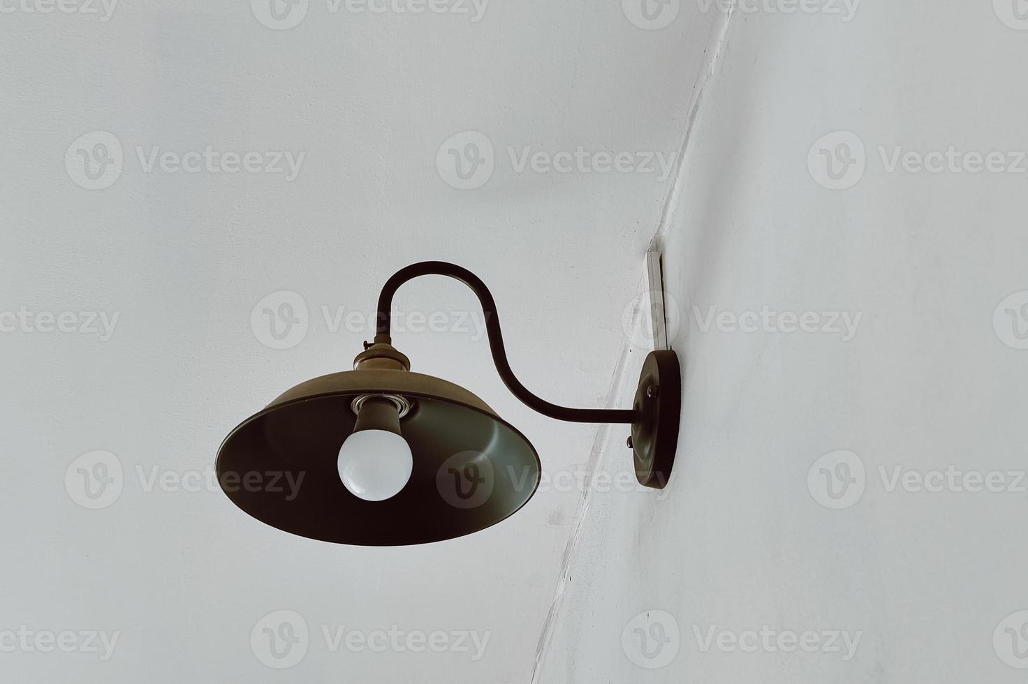 Beautiful vintage light decor. Lamp loft style. Lighting in design. Retro style photo